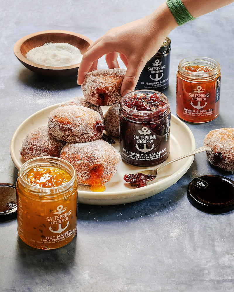 SaltSpring Kitchen Company Gourmet Jam-Filled Doughnuts with jars of preserves