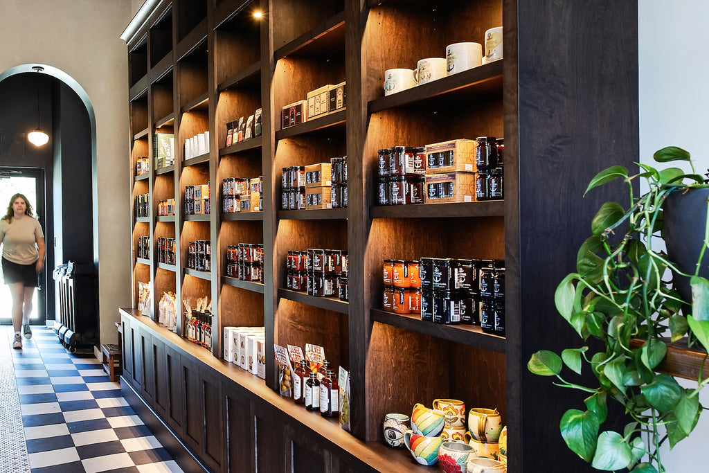Saltspring Kitchen Company Tasting Room - Shelving with preserves and ceramics