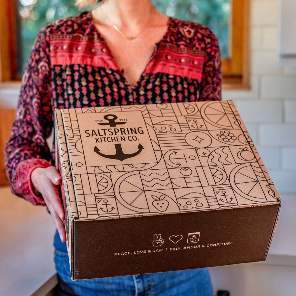 Salt Spring Kitchen Company Branded Shipping Box held by a woman