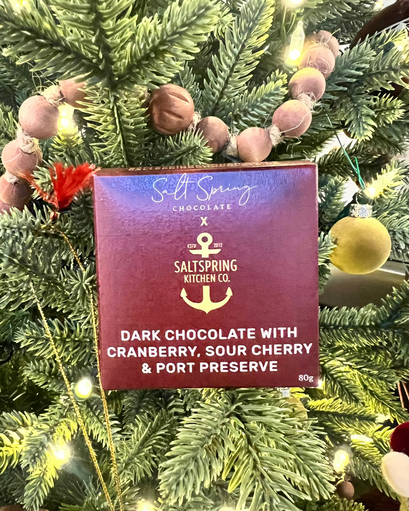 SaltSpring Kitchen Company Dark Chocolate Bar with Cranberry Sour Cherry and Port Preserve in front of the Christmas tree