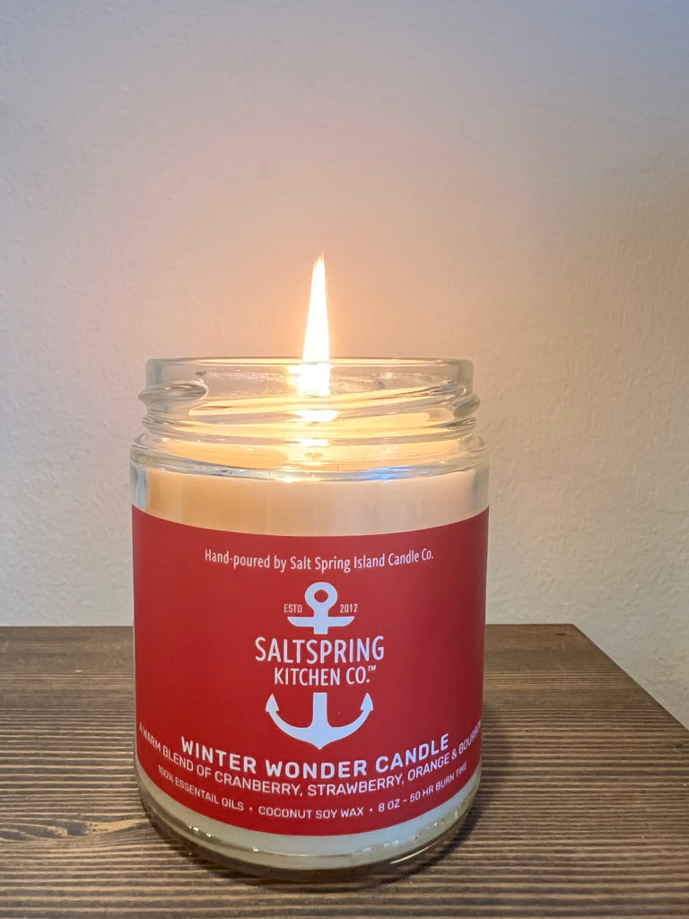 SaltSpring Kitchen Company Winter Wonder Candle lit on a table