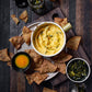 Salt Spring Kitchen Company Pineapple Turmeric Achiote Hot Sauce with queso dip and candied jalapenos