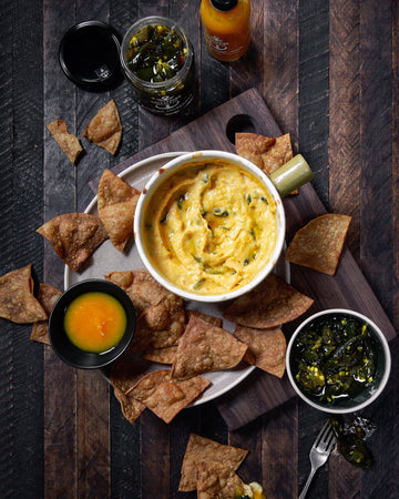 Salt Spring Kitchen Company Pineapple Turmeric Achiote Hot Sauce with queso dip and candied jalapenos