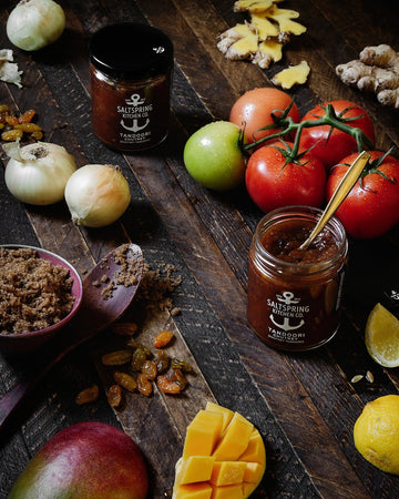 SaltSpring Kitchen Company Tandoori Chutney jar with ingredients on a table
